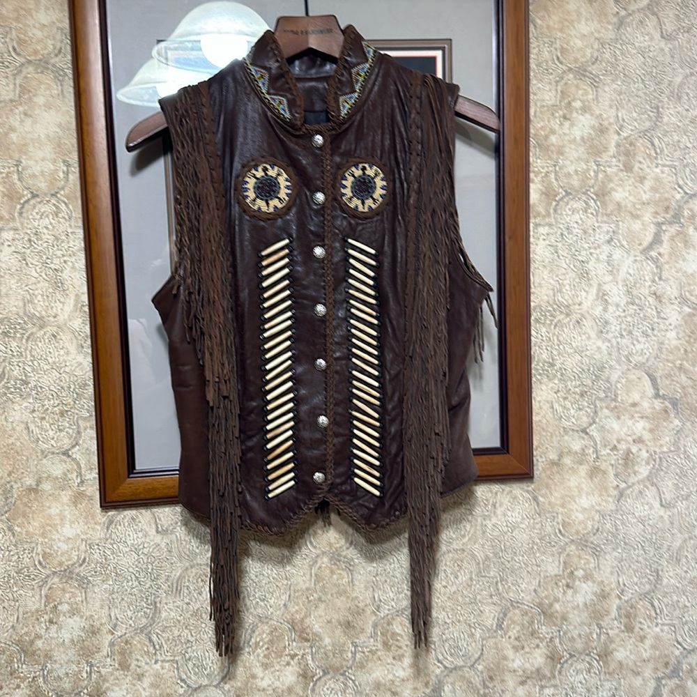 Diamond leather fringed vest.
